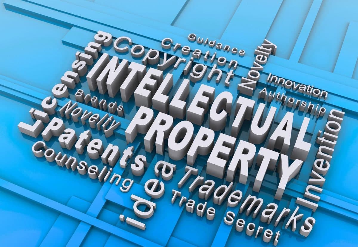 3D text reading Intellectual Property surrounded by patents, trademarks, and copyright terms